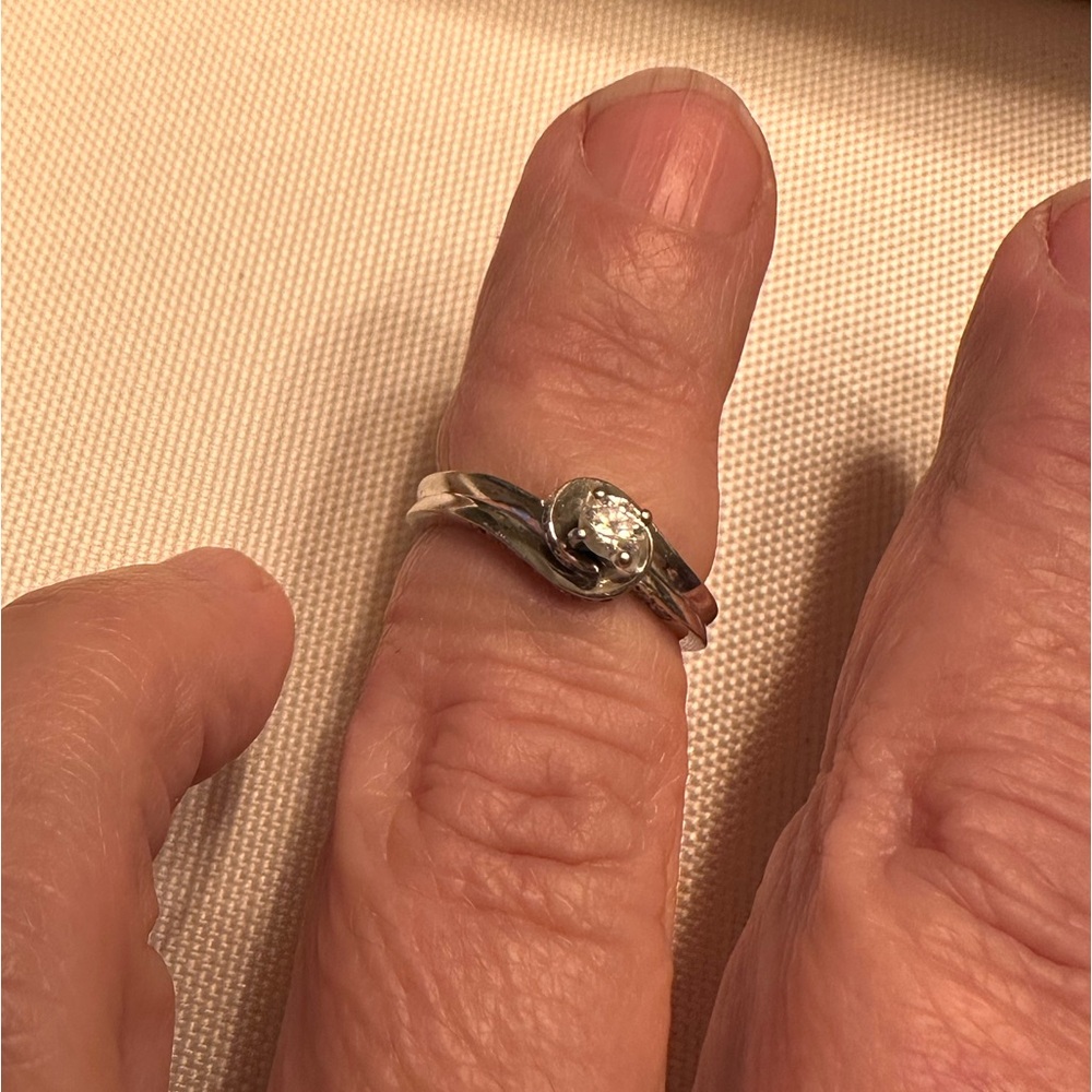 Size 5 small engagement ring. Very pretty and petite wrap design